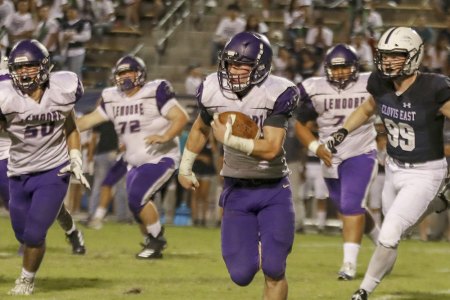 Running back William Kloster looks for an opening in Friday night's loss to Clovis East.